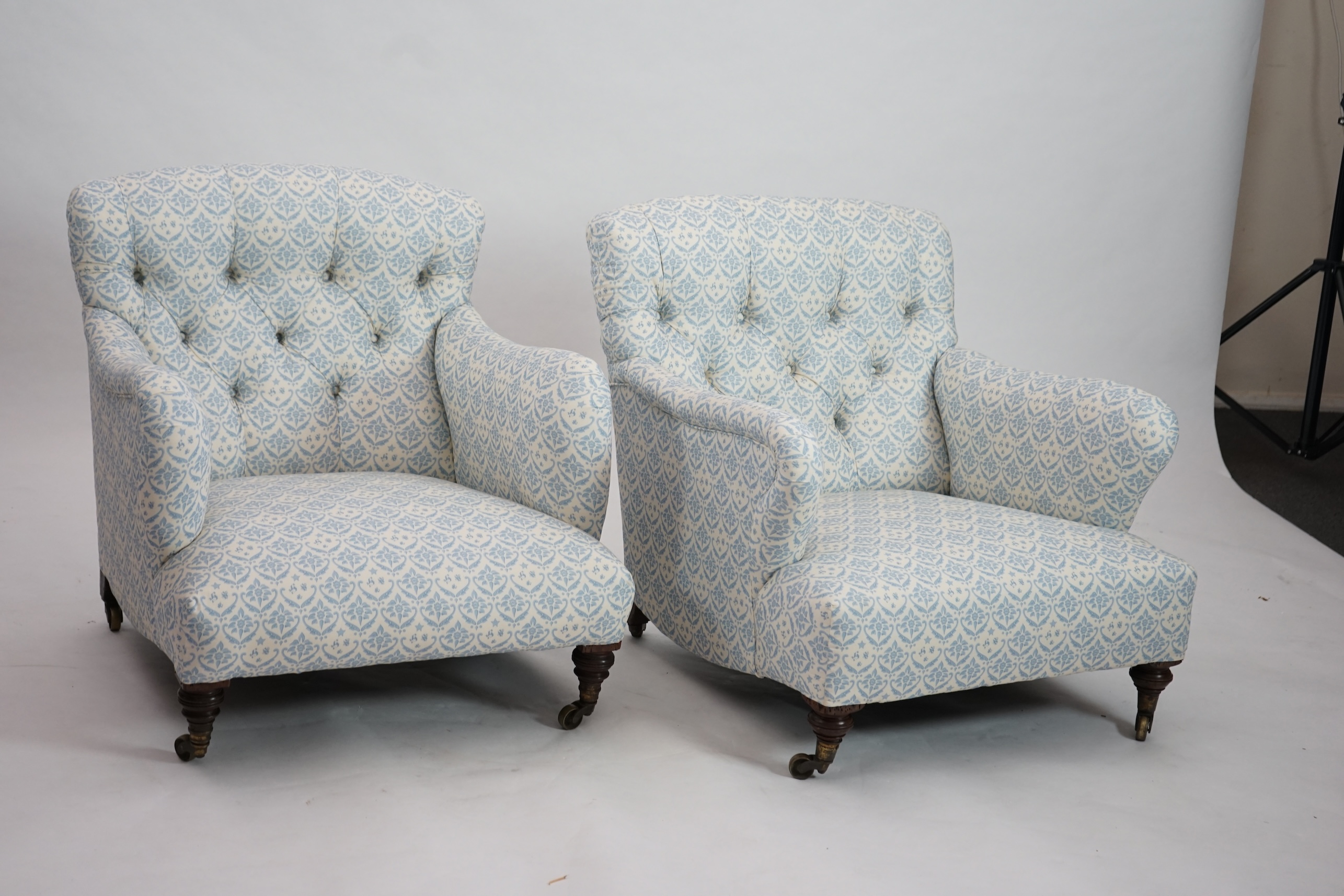 A Victorian Howard & Sons Bridgewater armchair and a similar Victorian armchair